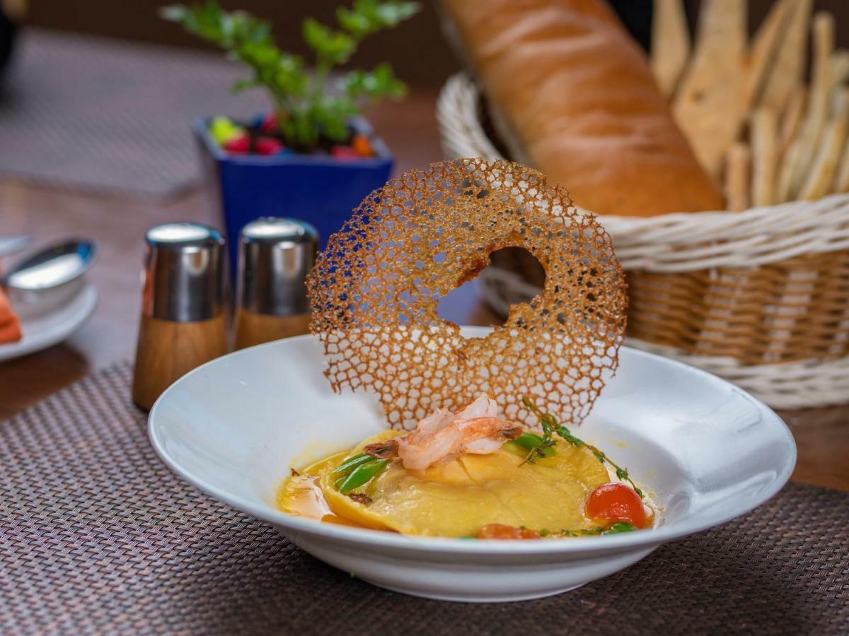 The Orchid Hotel Hinjewadi Pune Esterno foto A prawn and mango salad